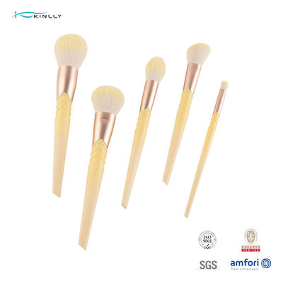 A composição plástica de 9 PCS escova o cabelo amarelo que mistura o grupo de escova cosmético
